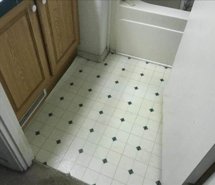 bathroom floor with water on floor